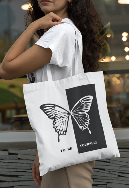 A LADY CARRYING A BEAUTIFUL BUTTERFLY DESIGN TOTE BAG OF TRENDYATRI.